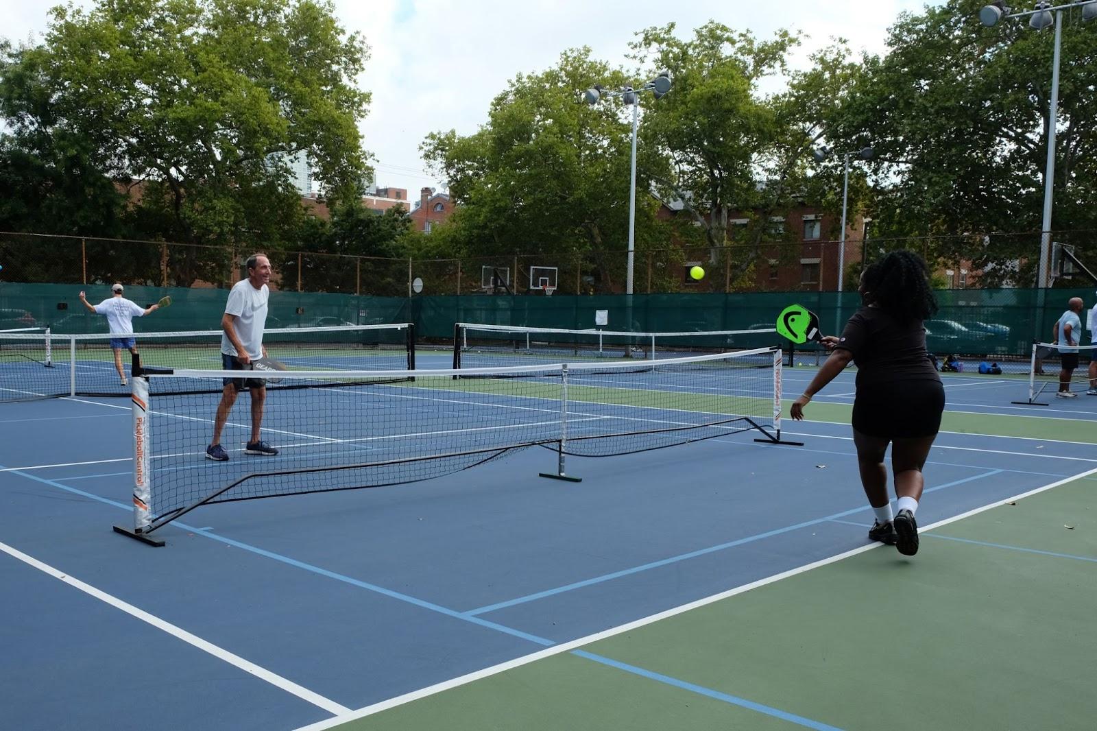 Two people playing pickleball.