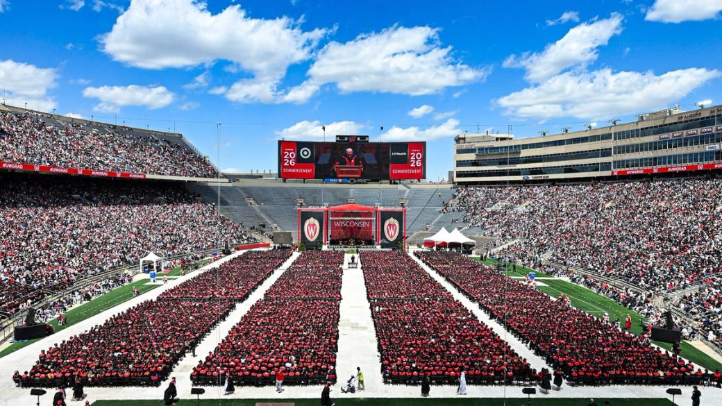 A football stadium is packed for a graduation ceremony at University of Wisconsin at Camp Randell. 