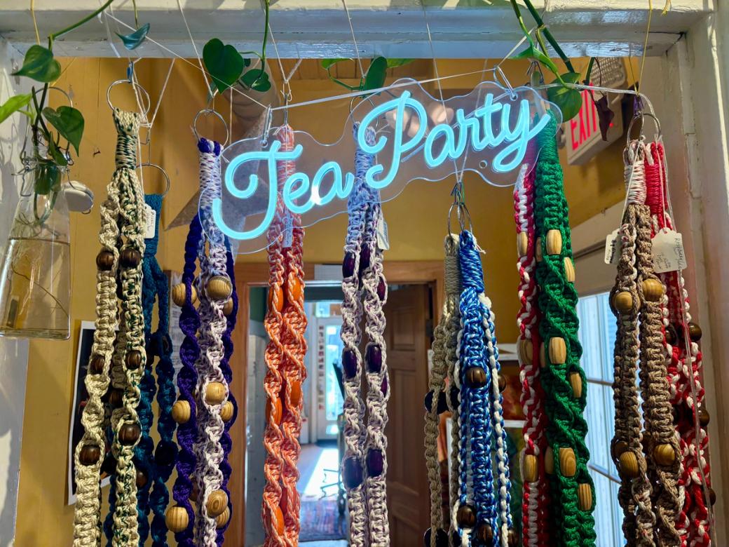 a tea party sign hanging with macrame