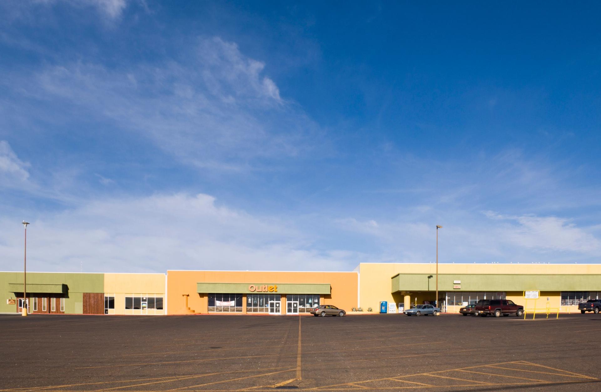 Photo of a bland strip mall.