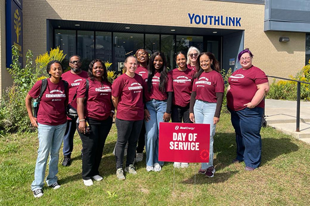 Display ad for Day of Service; Xcel energy team volunteering 