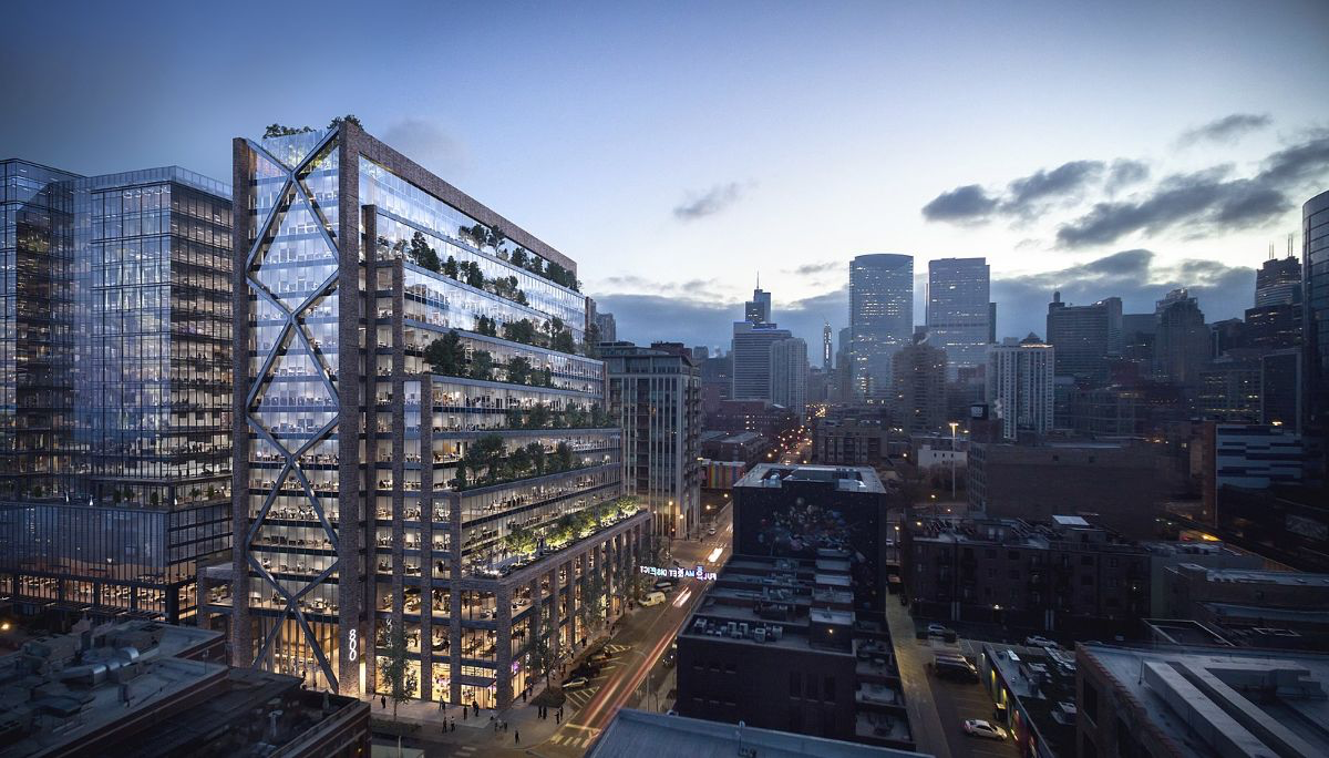A lit up 800 Fulton Market sitting across from cloudy weather