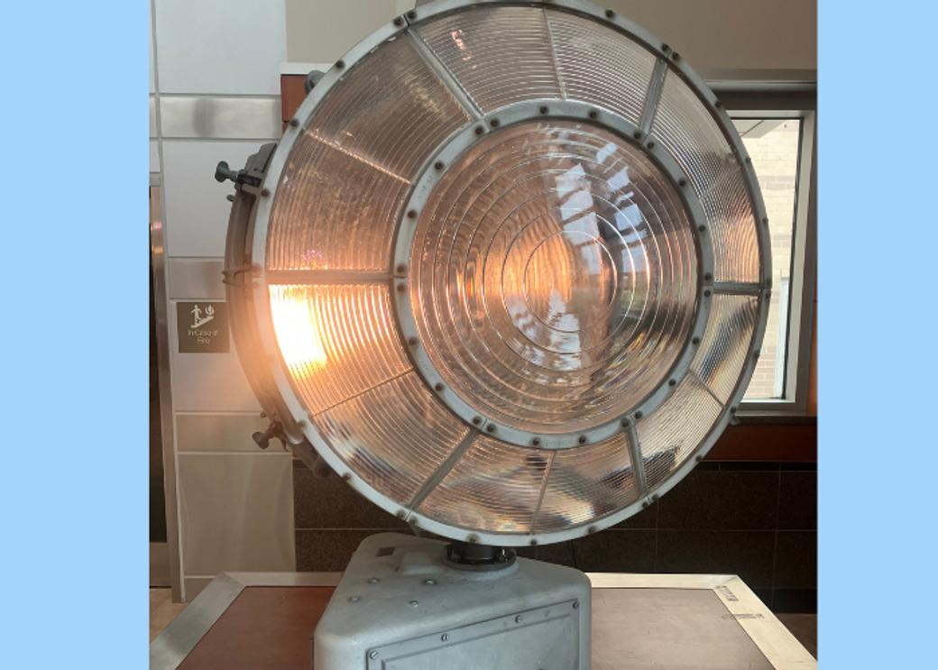 A large metal orb with a light bulb inside.