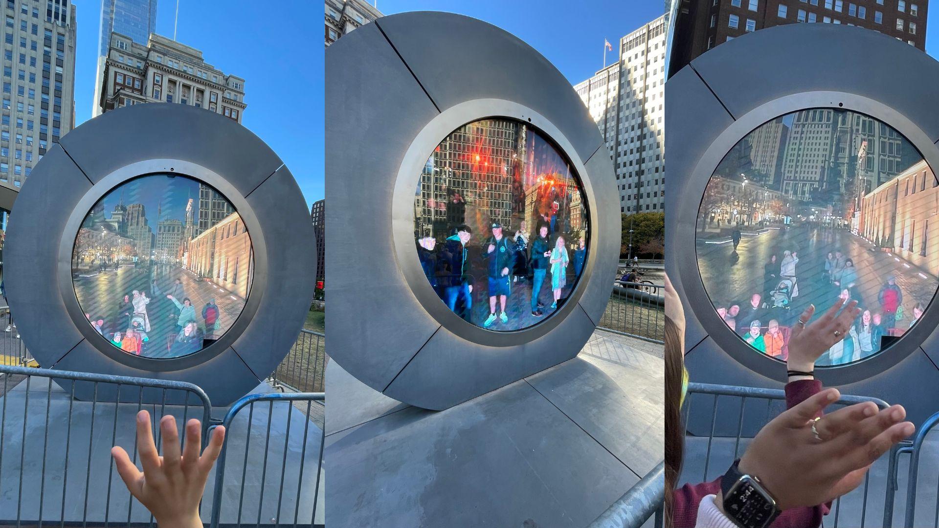 People waving at The Portal in Philly.
