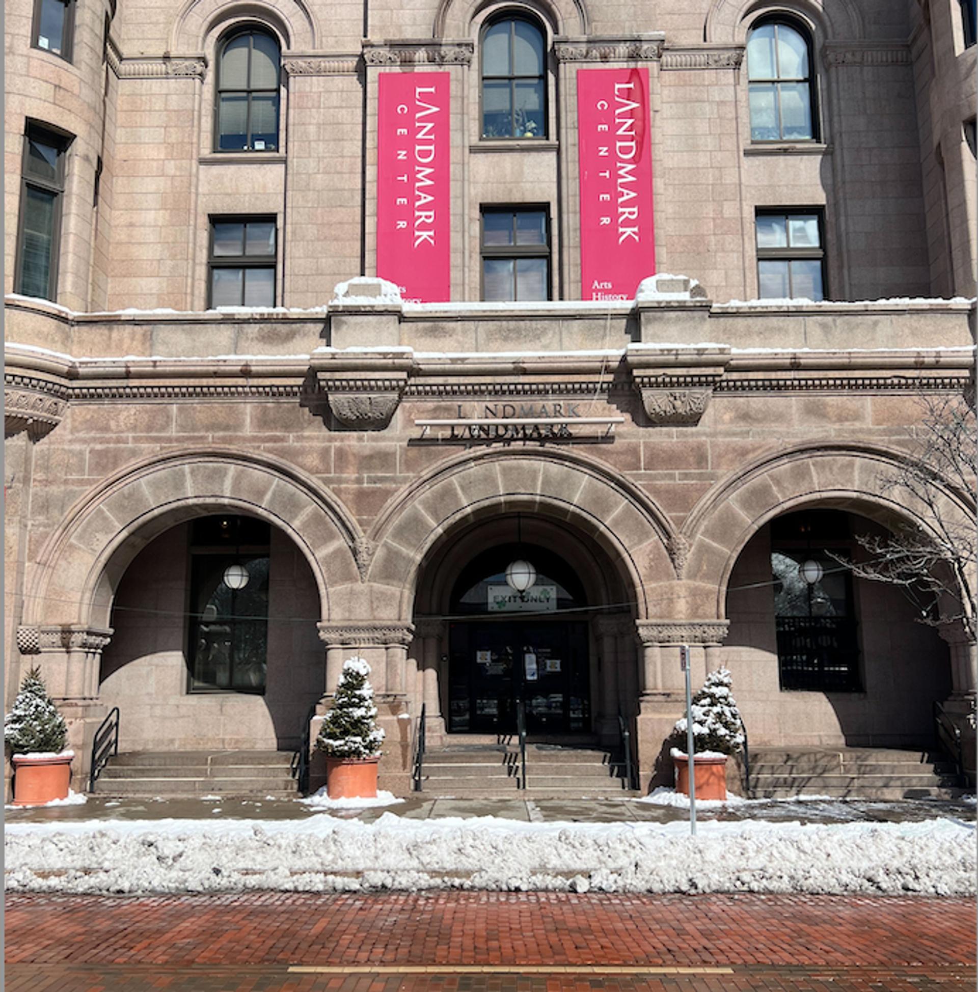 A large building with three arches for an entrance