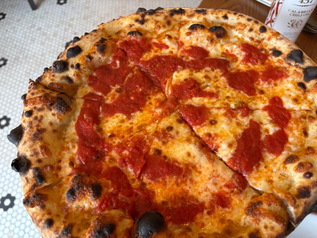 A whole cheese and pepperoni pizza.