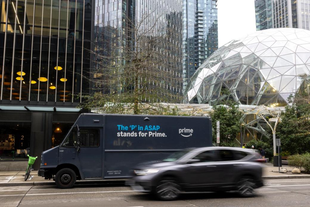 An Amazon Prime delivery van is parked outside Amazon headquarters in Seattle.