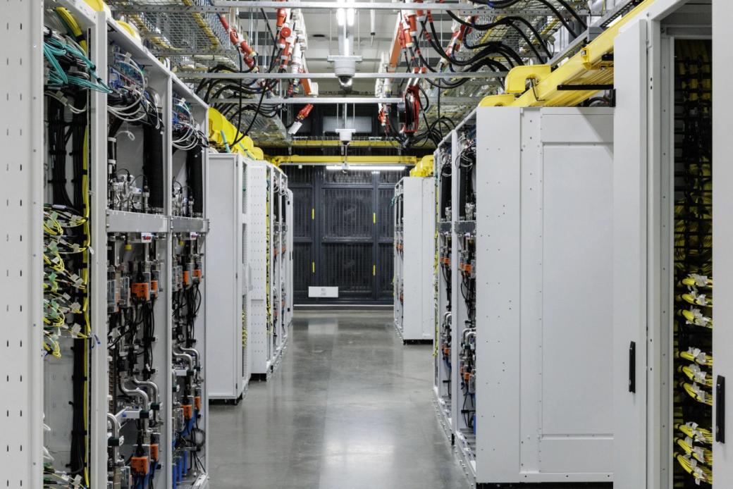 Racks of graphics processing units in a basement with a closed-loop liquid cooling system in a data center