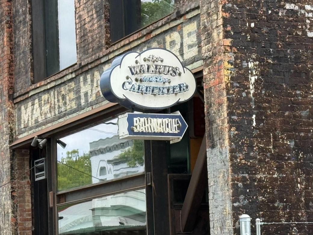 A photo of the Walrus and Carpenter sign in Ballard