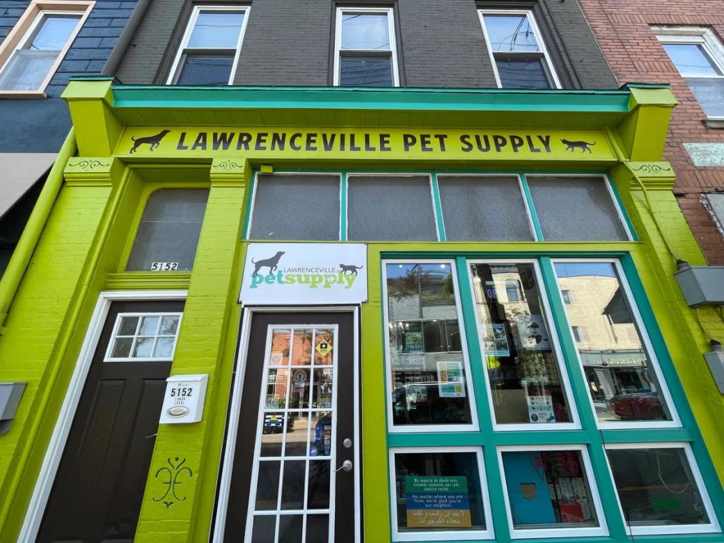 The bright green and blue storefront to Lawrenceville Pet Supply.