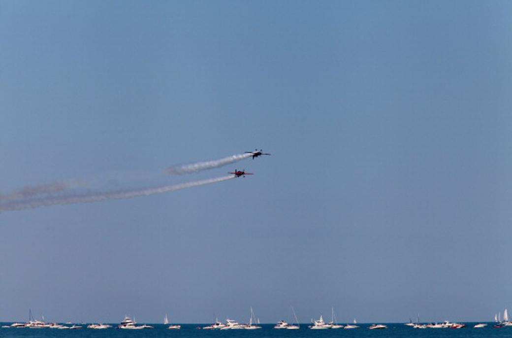 Two airplanes flying above Lake Michigan, Chicago, Illinois.