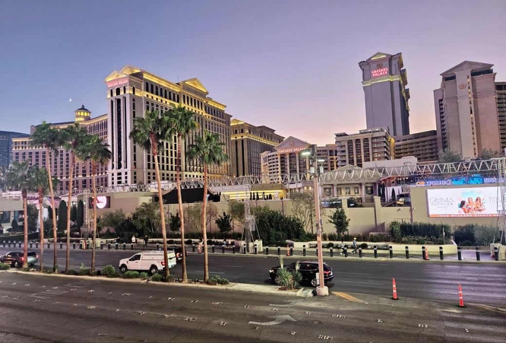 The exteriors of Caesars Palace and the Bellagio at dusk on the Las Vegas Strip.