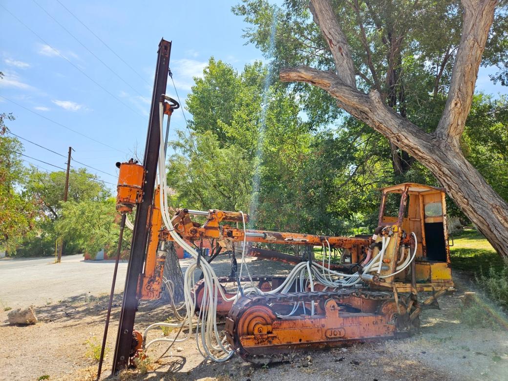 Construction equipment digs into the land.