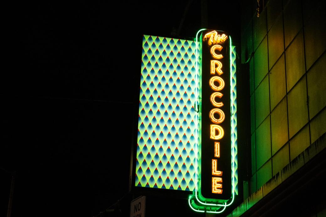 The Crocodile neon sign lit up at night