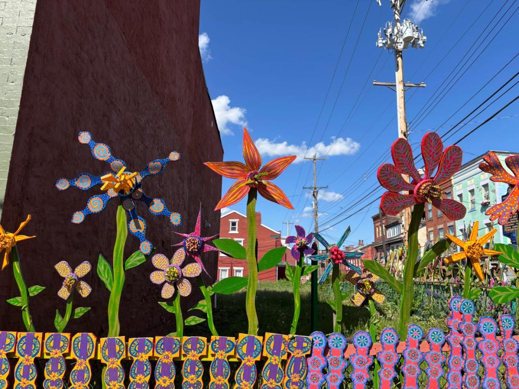 painted flowers on a fence