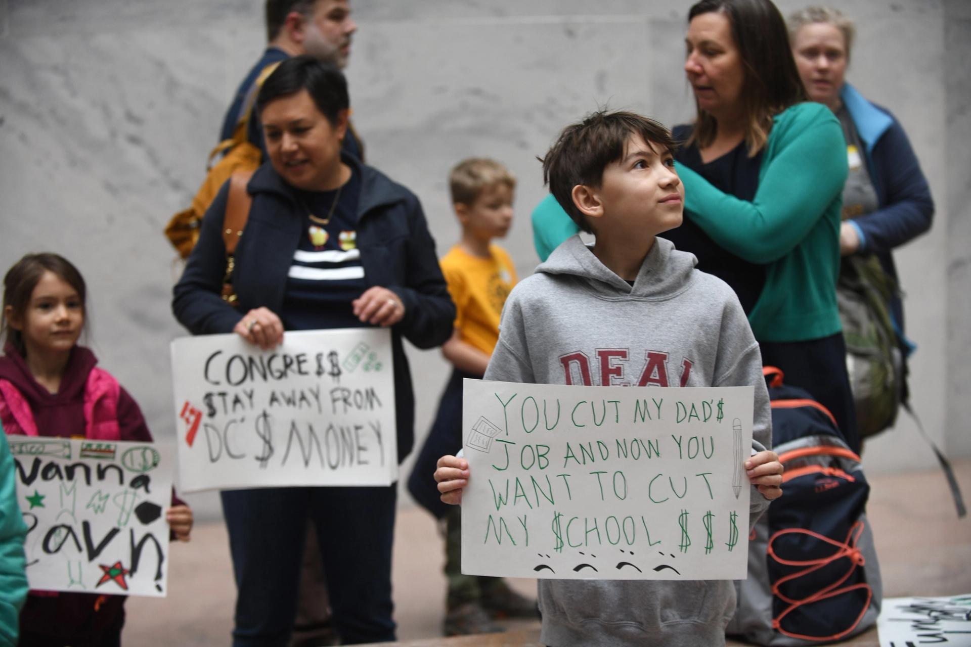 D.C. school children, parents, teachers and other protesters gathered inside the Senate Hart Building Atrium on Thursday to protest a feared $1.1 billion budget cut by Congress. (Astrid Riecken For The Washington Post/Getty Images)