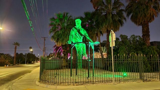 Photo of green-lit sculpture