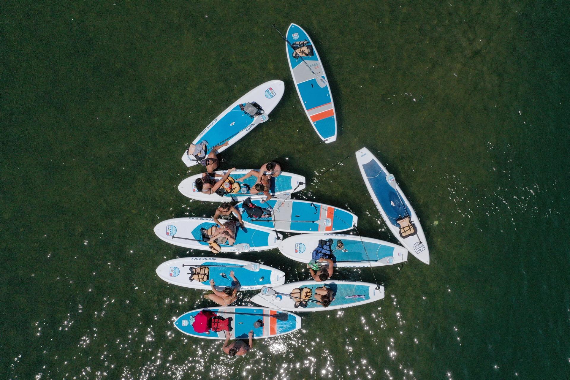 Paddleboards sit on blue water.