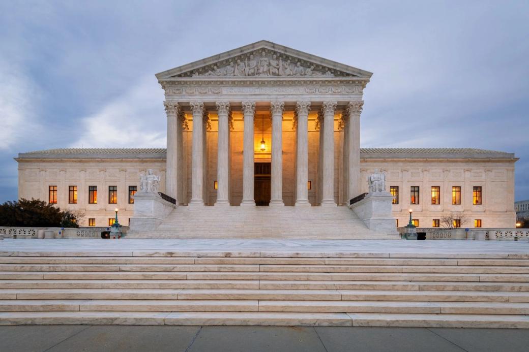 Illuminated lamps glow in the West Plaza at the U.S. Supreme Court Building.