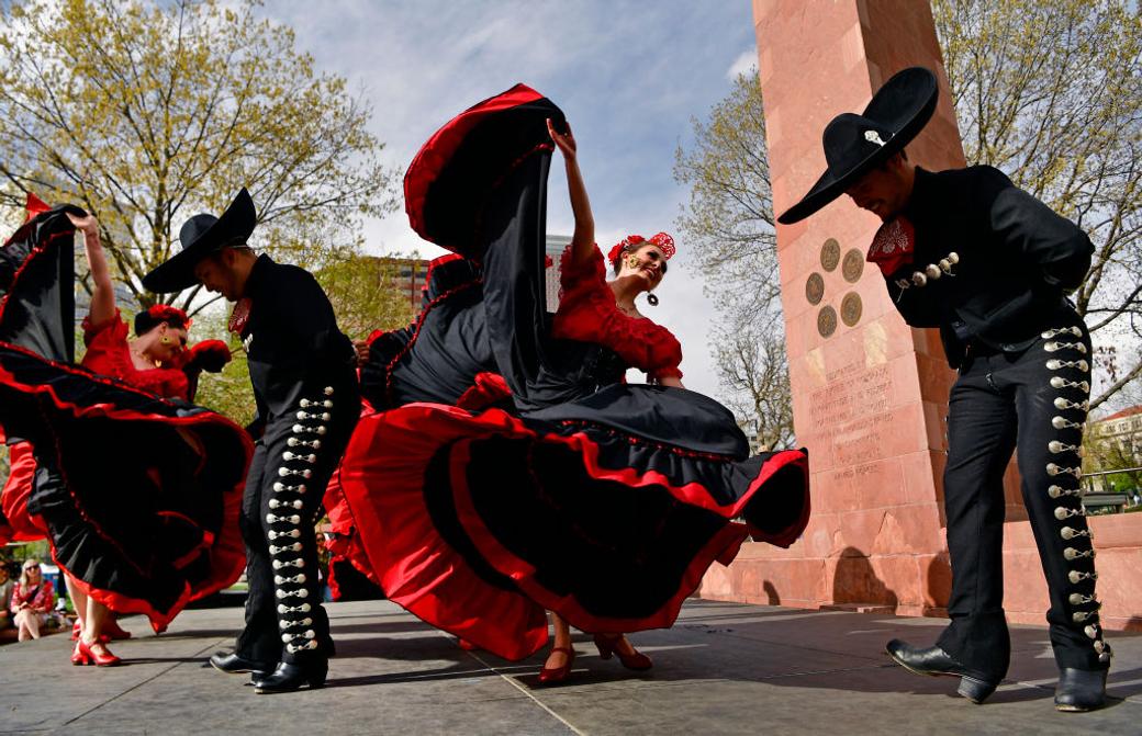 Dancers perform in traditional Mexican attire at Cinco de Mayo festival