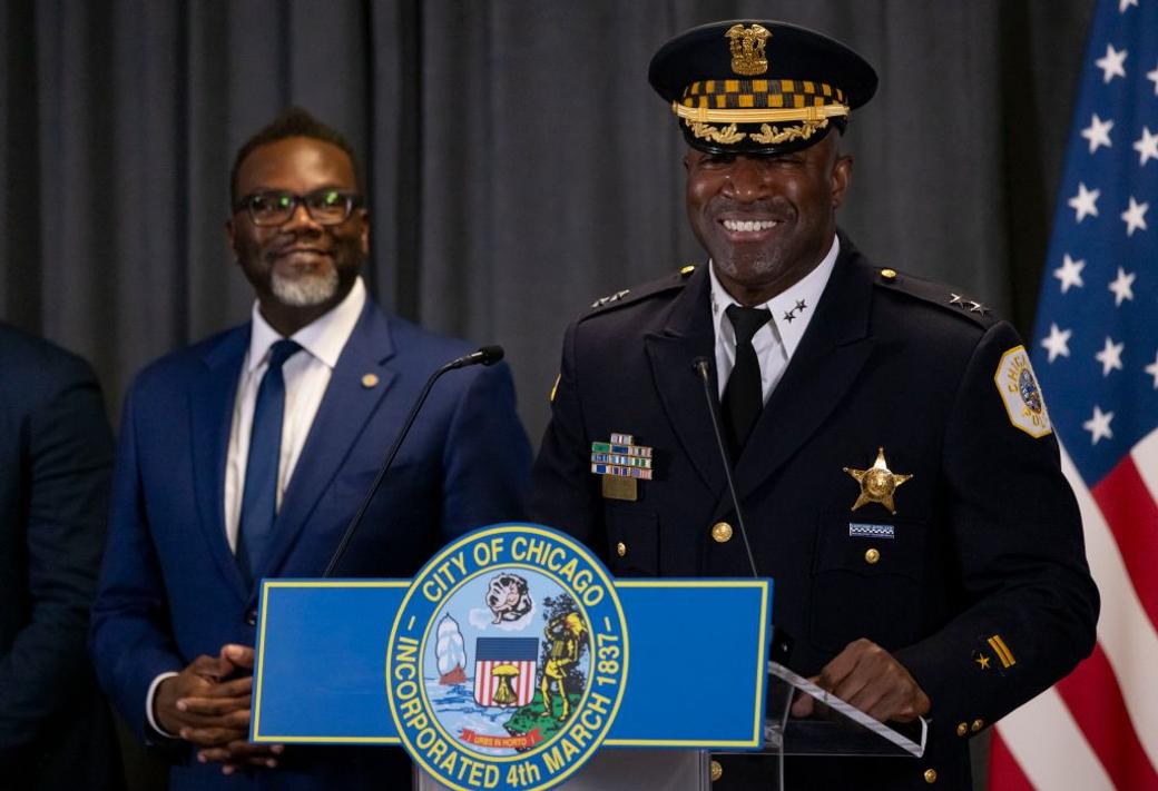 Mayor Brandon Johnson in the background watching Chicago Police Chief Larry Snelling take the podium after Johnson introduced Snelling as his choice for the next superintendent on Aug. 14, 2023, at City Hall. 