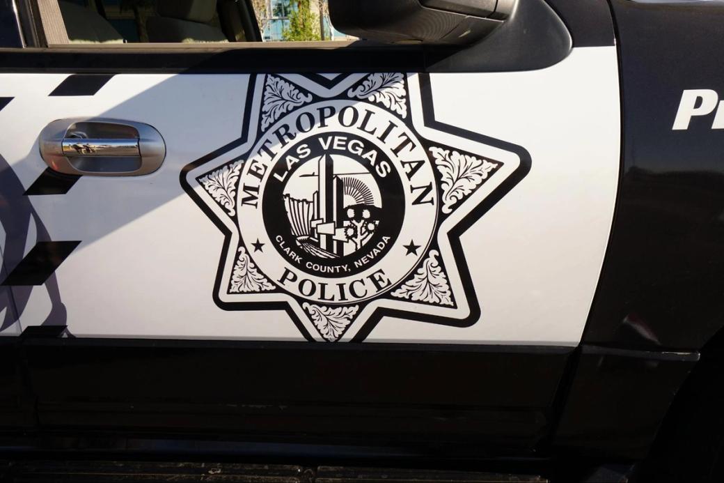 A close-up of the black-and-white logo on a Metro Police car