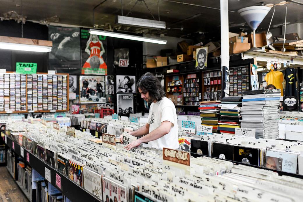 Person looks through records in a store