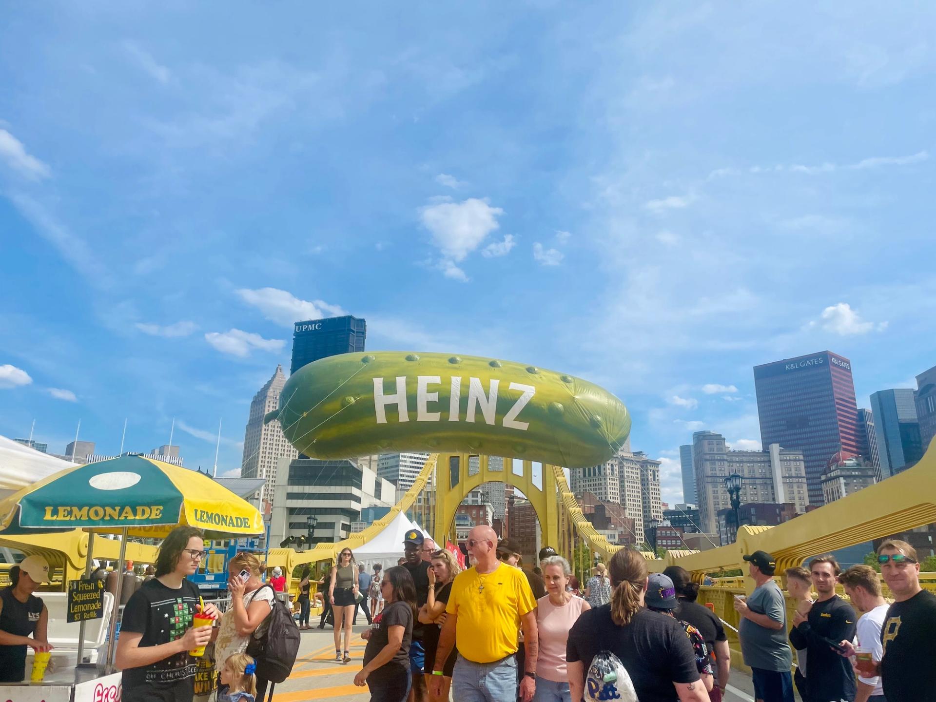Heinz pickle balloon hanging over Clemente Bridge
