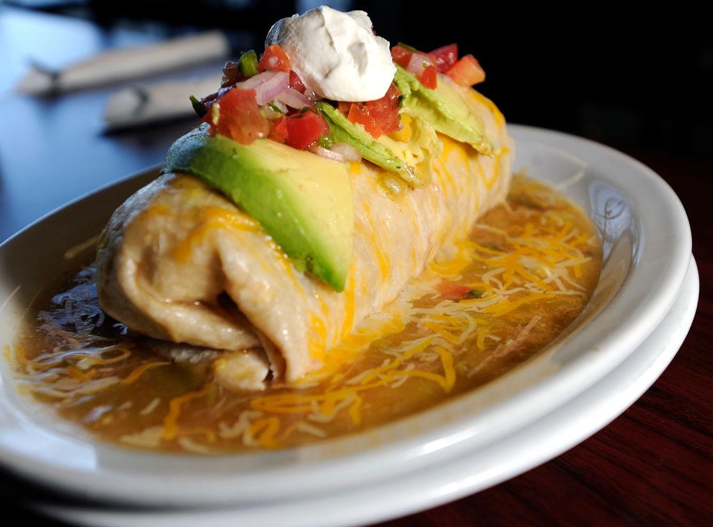 A burrito smothered in green chile — denver sytle