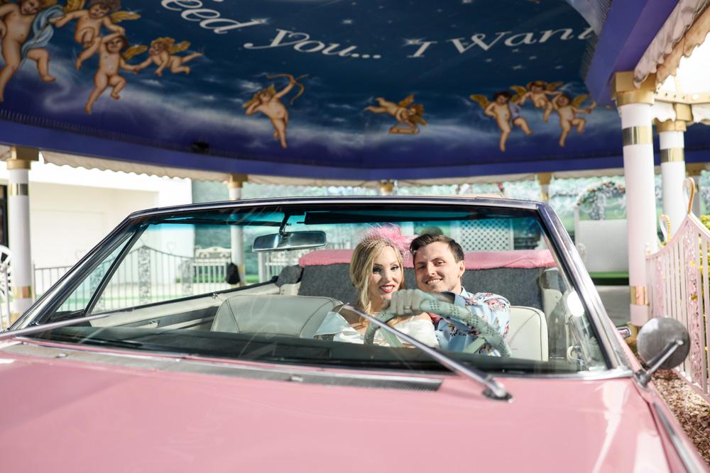 Newlyweds at a drive-thru wedding chapel.