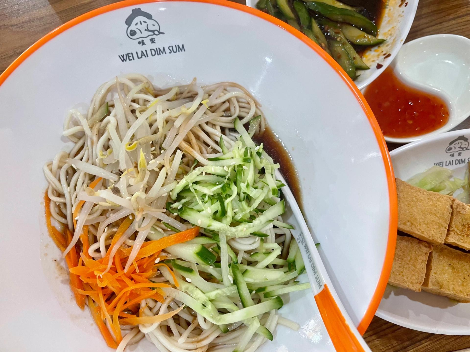 cold noodle salad with carrots, cucumbers, and bean sprouts