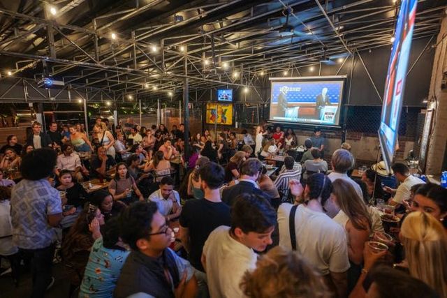 People at Union Pub watch the first presidential debate of the 2024 election between former President Donald Trump and President Joe Biden. (The Washington Post /Getty Images)