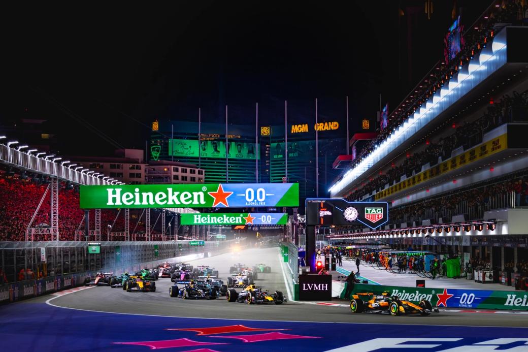 A race track with a large sign reading "Heineken."