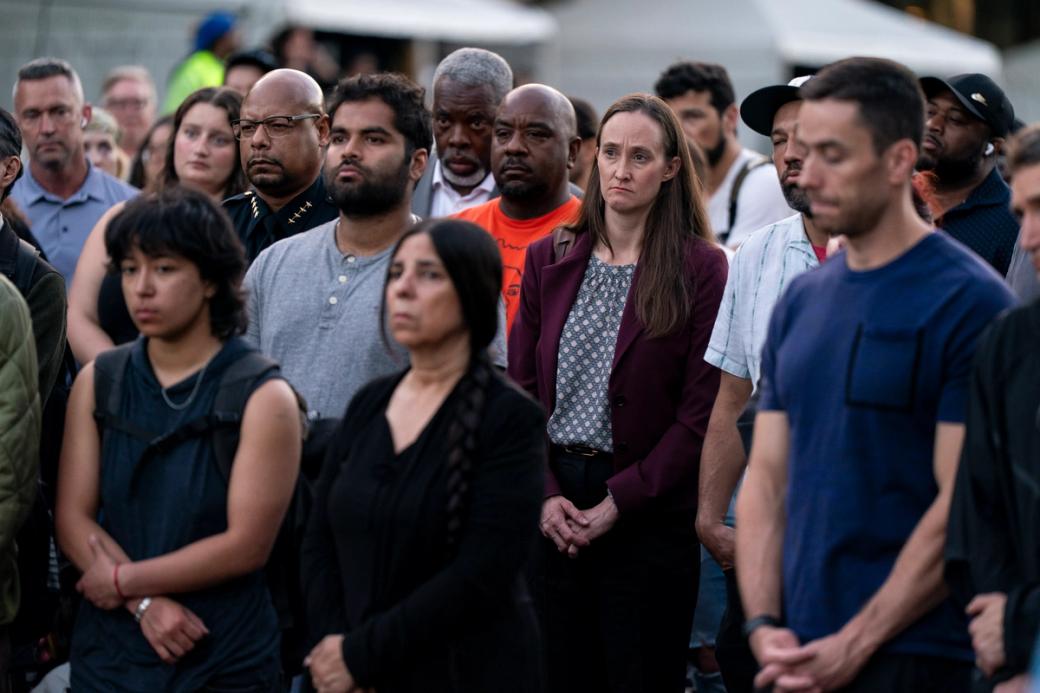 Mayor Wilson stands with then-police chief Shon Barnes and mourners at Bite of Seattle shooting vigil