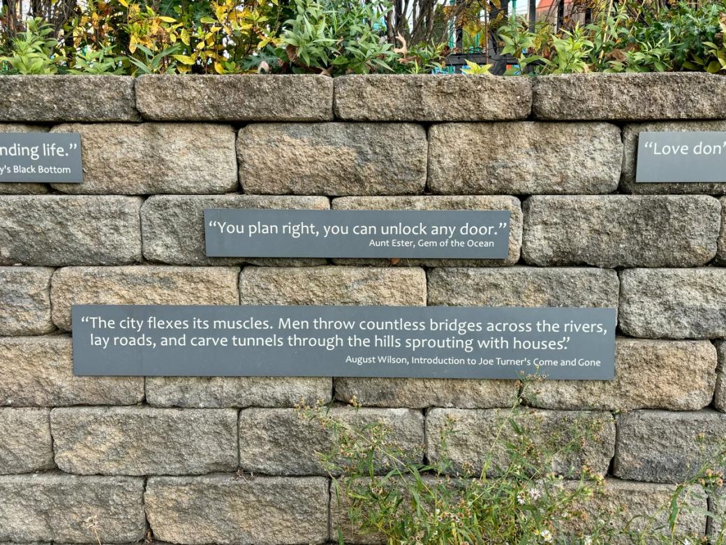 Quotes from August Wilson’s plays decorate the stone wall at the August Wilson Park