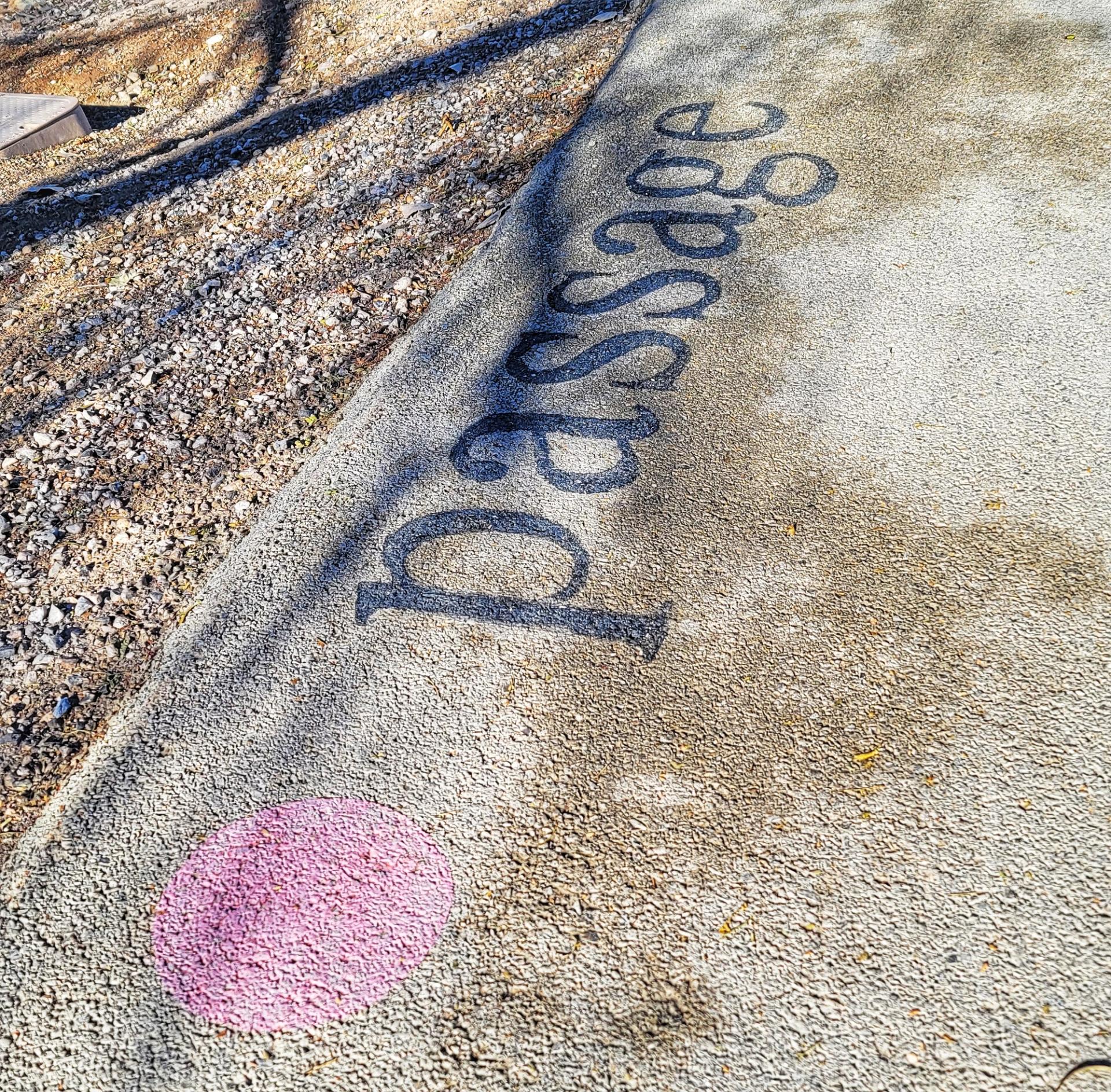 Photo of the word "passage" painted on the ground in Las Vegas.