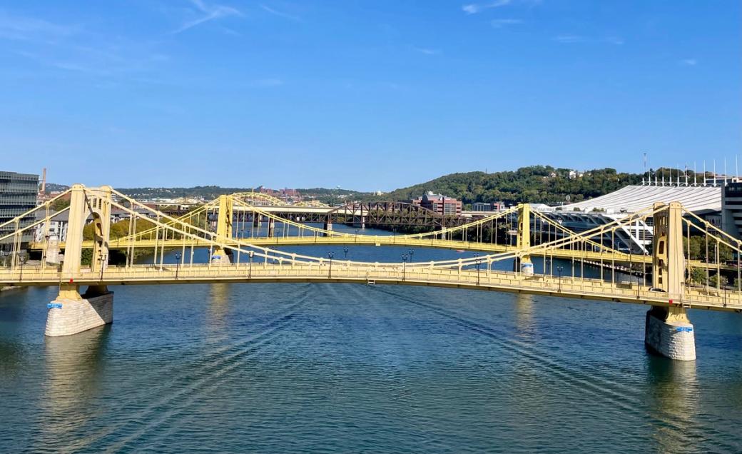An image of the Andy Warhol Bridge in the foreground with the Rachel Carson Bridge behind it.