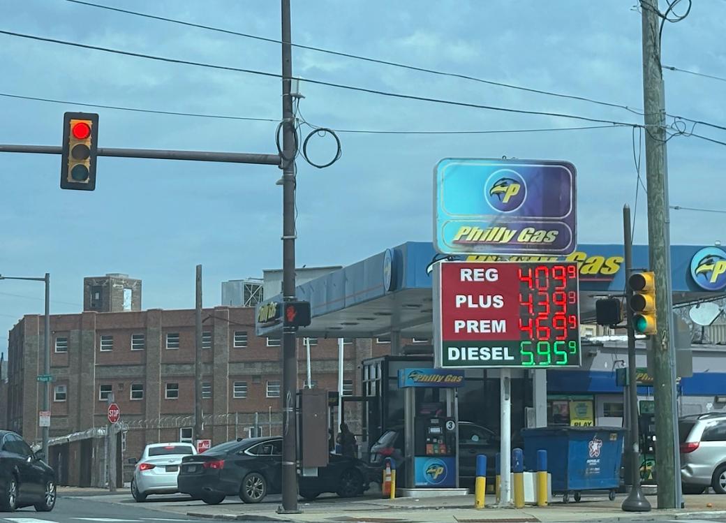 Philly Gas lists prices of gas at $4.09 (regular), $4.39 (plus), $4.69 (premium), and diesel at $5.95 on a sign