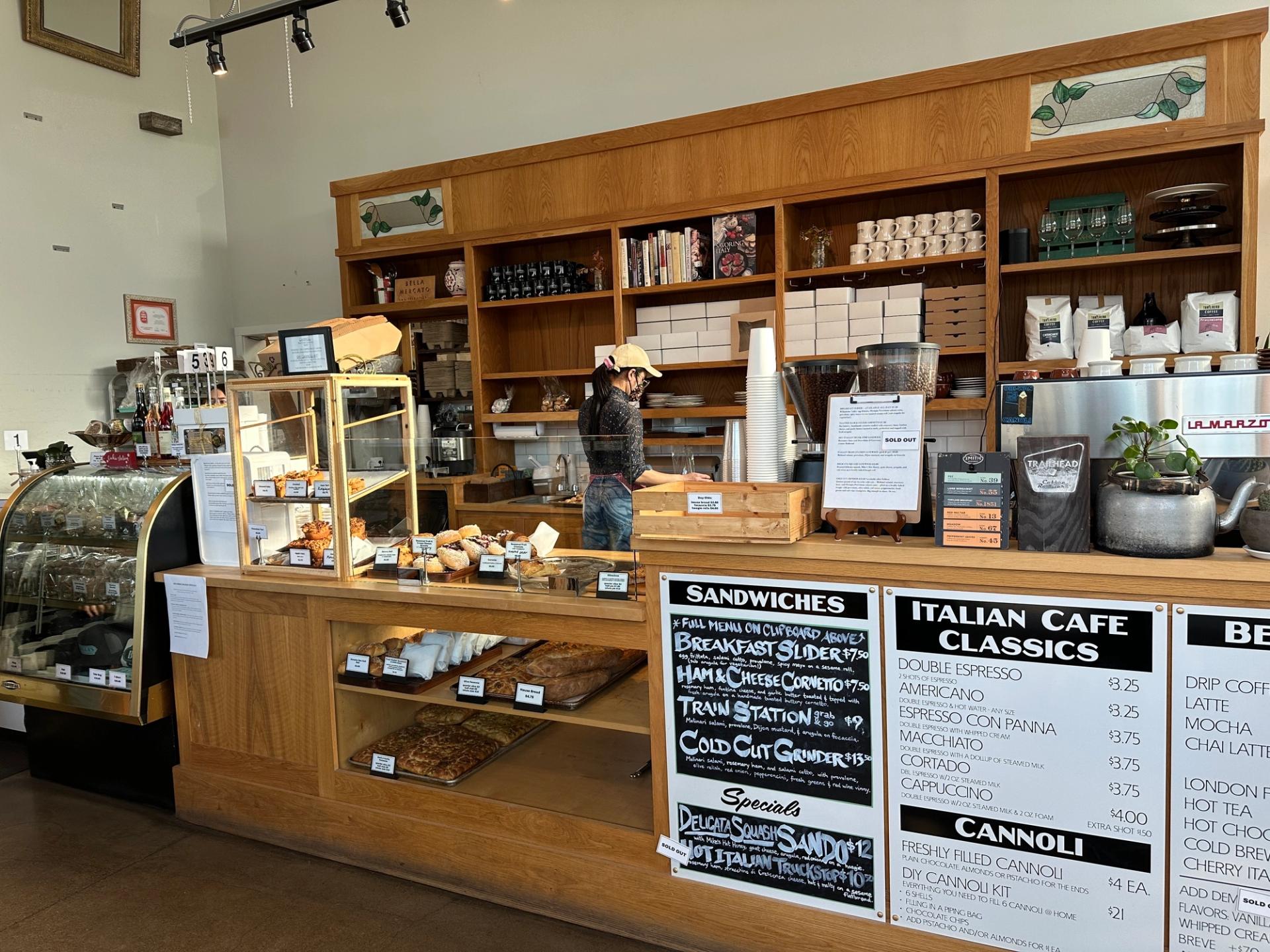 wooden bakery counter with glad display underneath