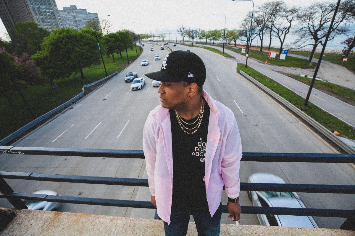 Host Jacoby Cochran on a bridge above a highway