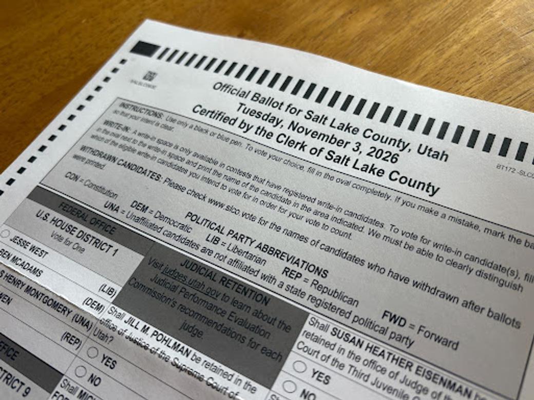 A paper ballot that says "Official Ballot for Salt Lake County, Utah." It features instructions for filling out the ballot as well as candidates for U.S. House District 1 and judges for retention.