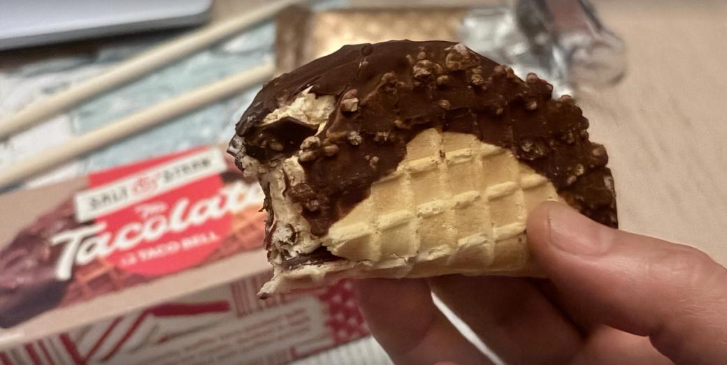 A hand holds a Salt & Straw Tacolate.
