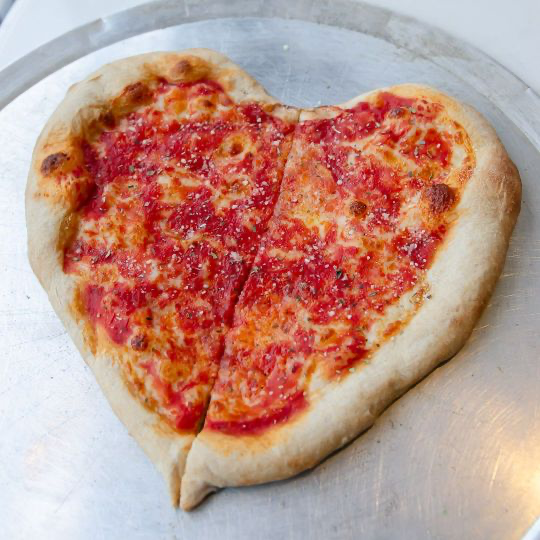 A festive heart-shaped pie from Pizzeria Davide. (Courtesy of DiAnoia's)
