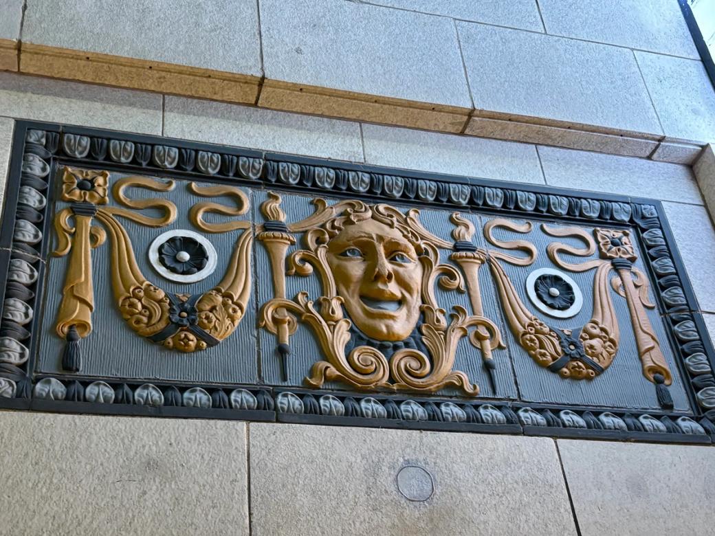 face carved relief in a building