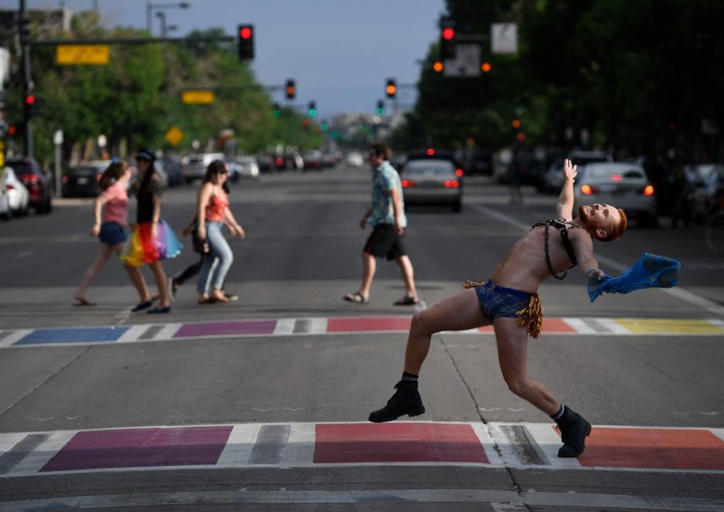 Ben Shettsline struts his stuff across the Broadway rainbow crosswalk during the annual Crosswalk Walk-Off June 15, 2018.
