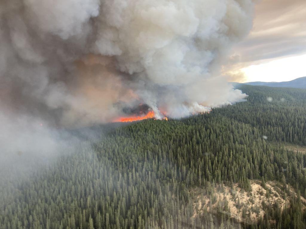 Fire and smoke on Tatkin Lake in British Columbia, Canada on July 10, 2023.