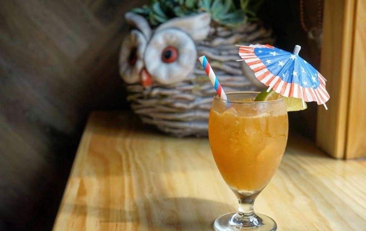 An American flag–themed umbrella sits in a cocktail