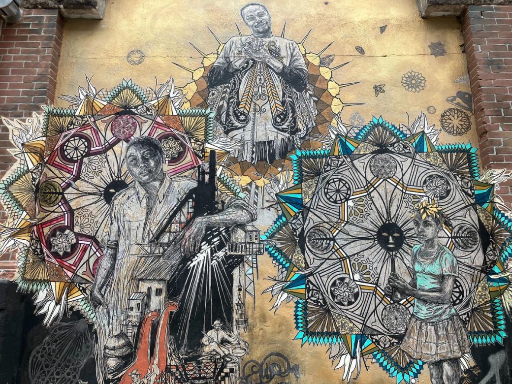 Mosaic-like wheatpaste art of 3 figures