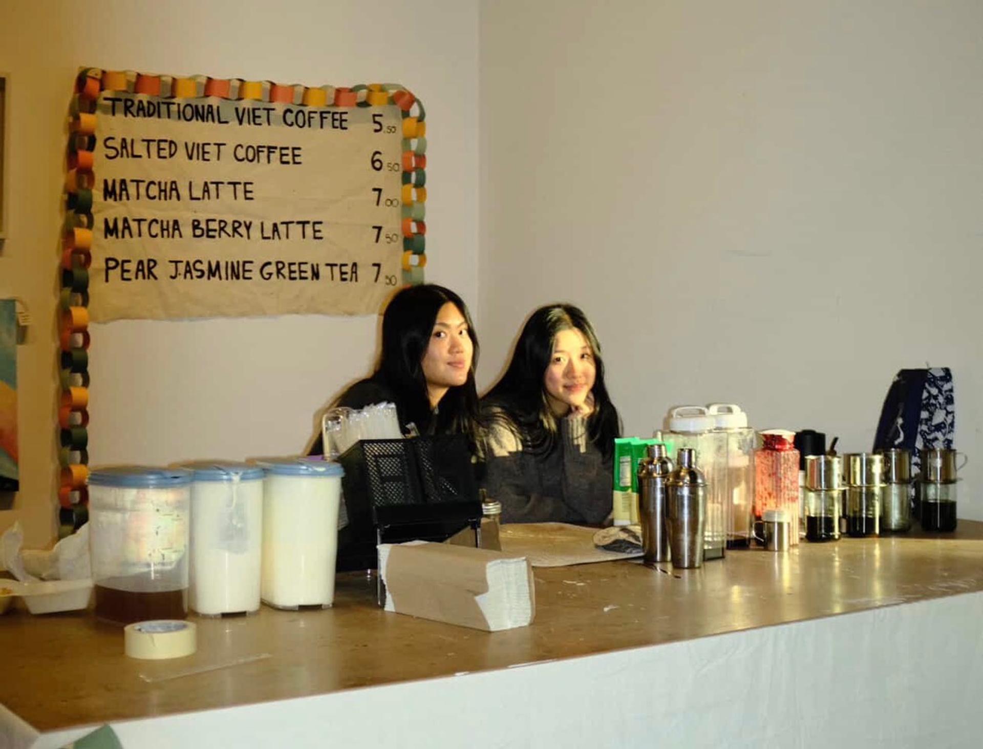 Two women behind a counter