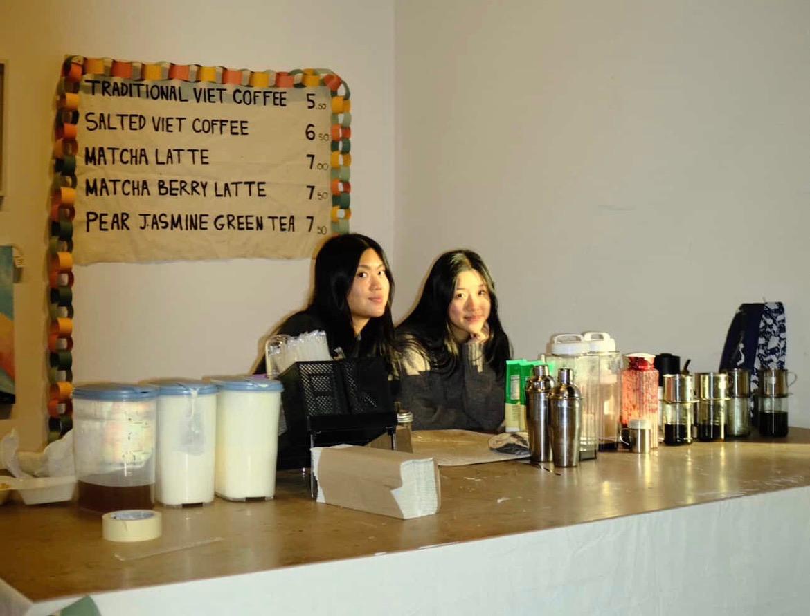 Two women behind a counter
